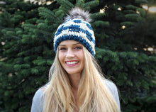 Load image into Gallery viewer, girl smiling wearing blue crochet beanie with basket weave pattern