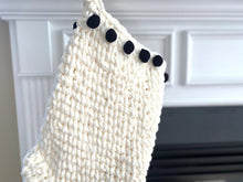 Load image into Gallery viewer, black pom pom border on a white stocking