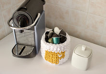 Load image into Gallery viewer, top down view of coffee station with Nespresso capsules