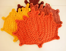 Load image into Gallery viewer, pile of crochet maple leaves