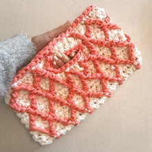 Load image into Gallery viewer, hand holding a pink handbag