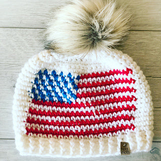crochet hat with American flag and furry pom pom