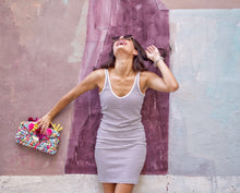 Load image into Gallery viewer, girl laughing holding a colorful boho bag 
