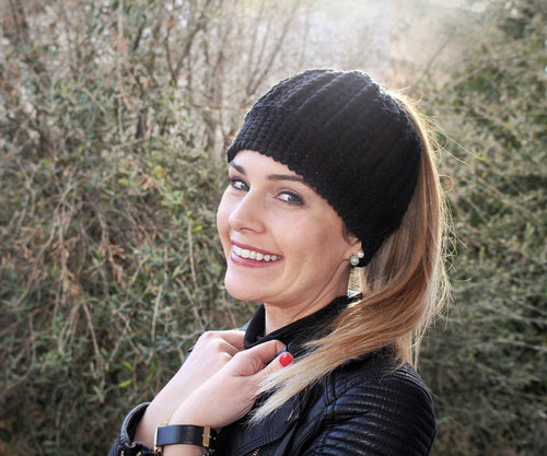 girl with leather jacket smiling wearing black beanie