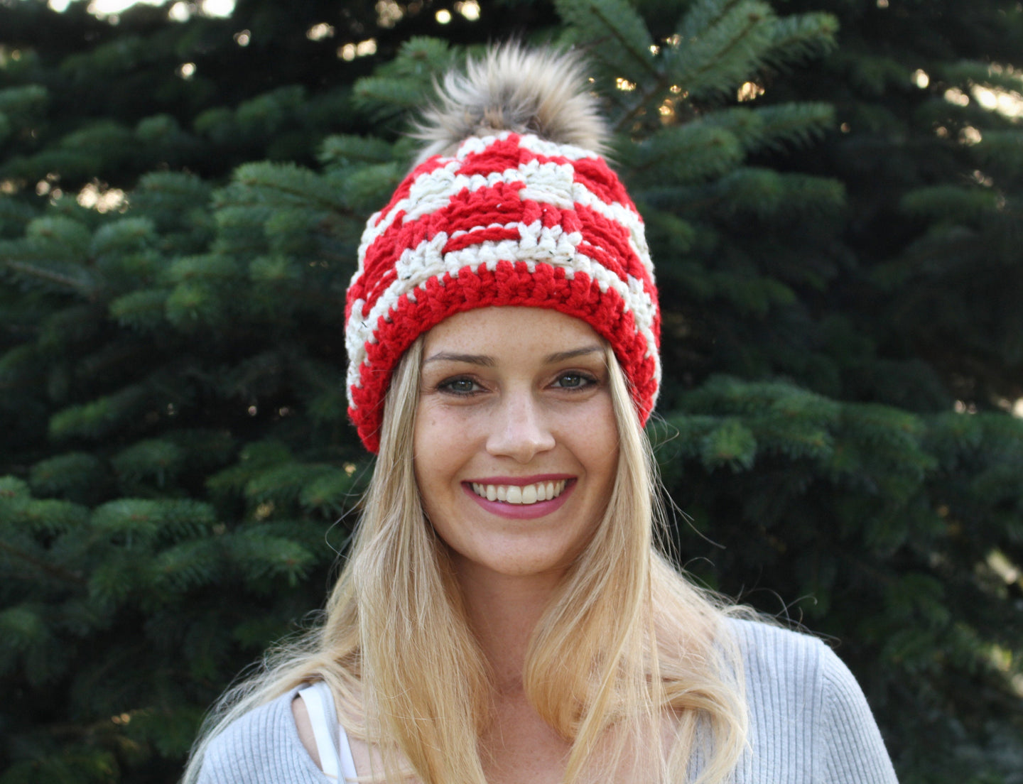 Girl smiling wearing red beanie