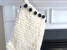 Load image into Gallery viewer, black pom pom border on a white stocking 
