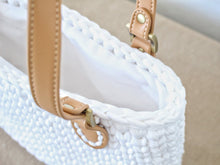 Load image into Gallery viewer, top view of a crochet bag with brown leather straps
