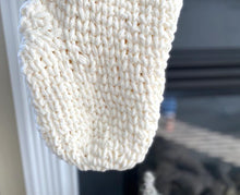 Load image into Gallery viewer, the toe of a crochet christmas stocking 
