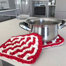 Load image into Gallery viewer, red and white zig zag oven mitts on the counter next to a pot
