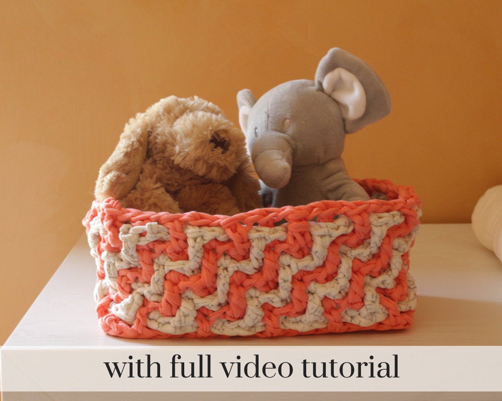 Pink crochet zig zag basket with stuffed animals inside