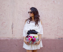 Load image into Gallery viewer, girl with white dress holding a colorful pom pom clutch
