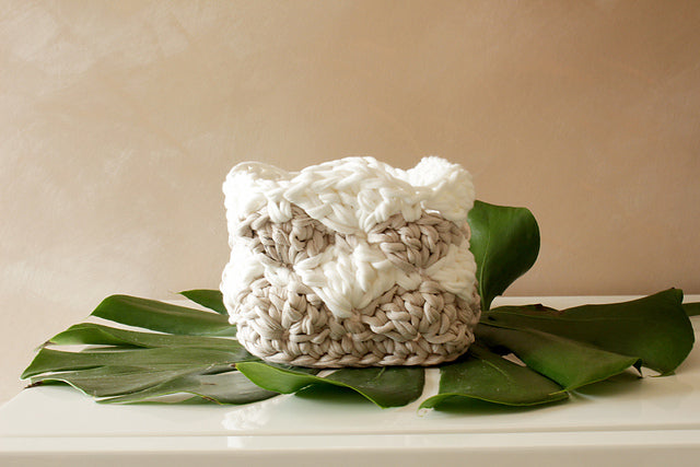 shell stitch basket on a green leaf