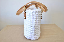 Load image into Gallery viewer, side view of a crochet bag with brown leather straps

